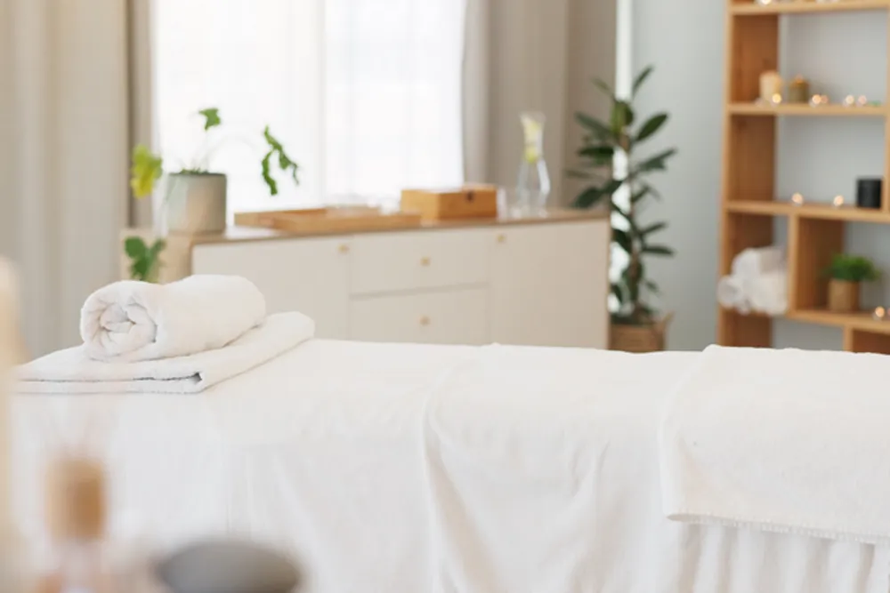 Calm treatment room with fresh towels at Uplift Wellness & Aesthetics in Monteagle, TN